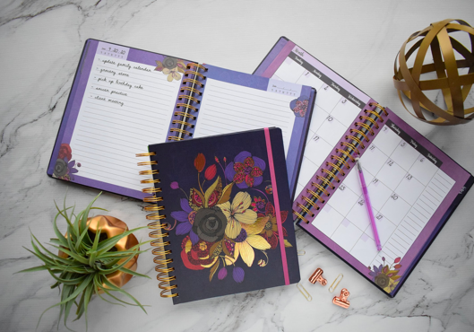 An open planner and notepad
